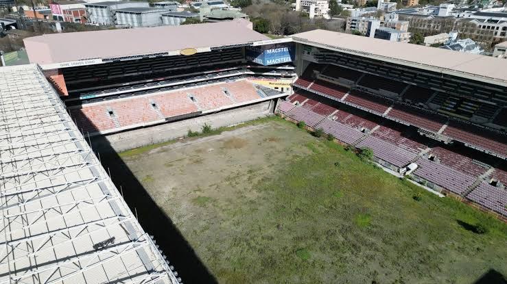 Aerial view of Newlands Stadium with an overgrown pitch